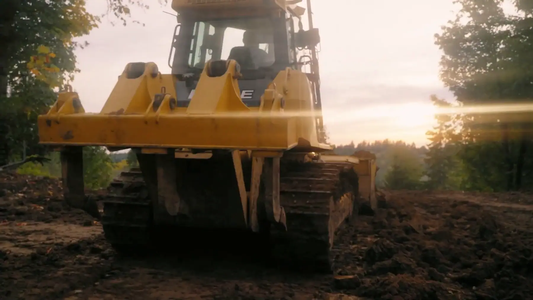 LPG dozer pushing a pass of grade at sunset